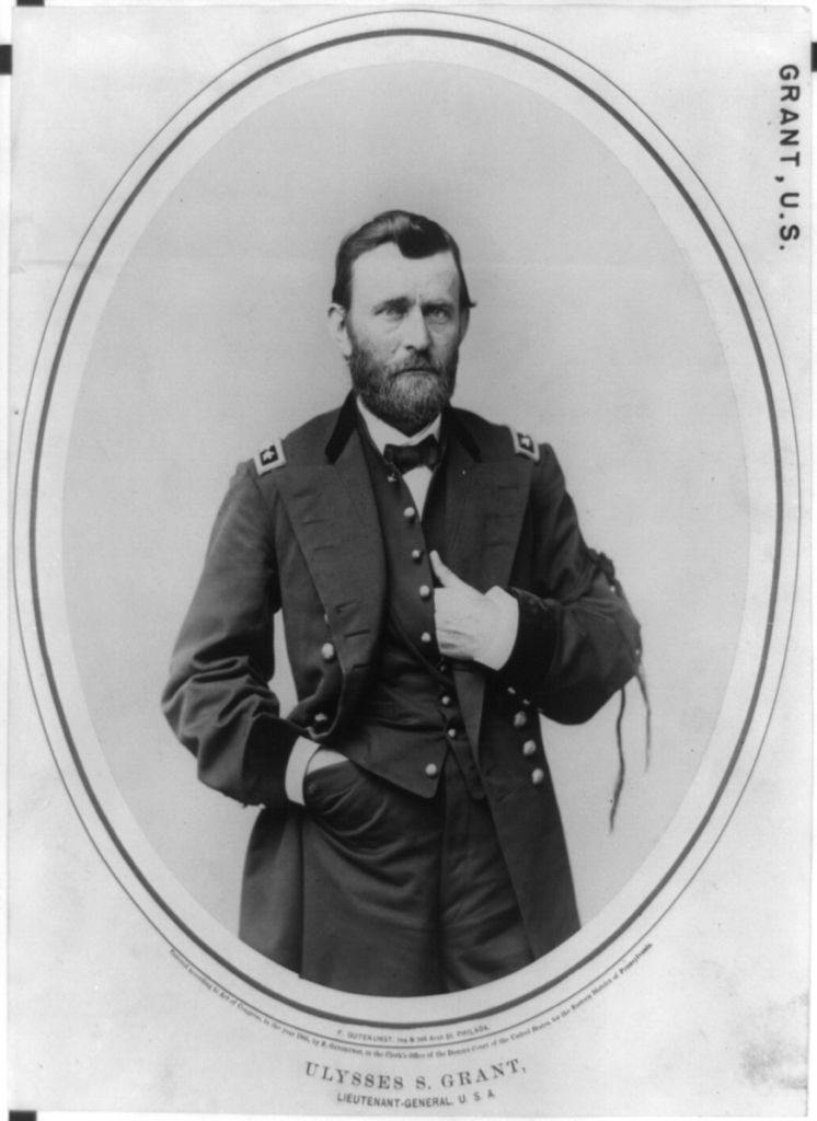 Army general with a beard and with bow tie, uniform including long unbuttoned coat and buttoned waistcoat, and mourning band on his right arm